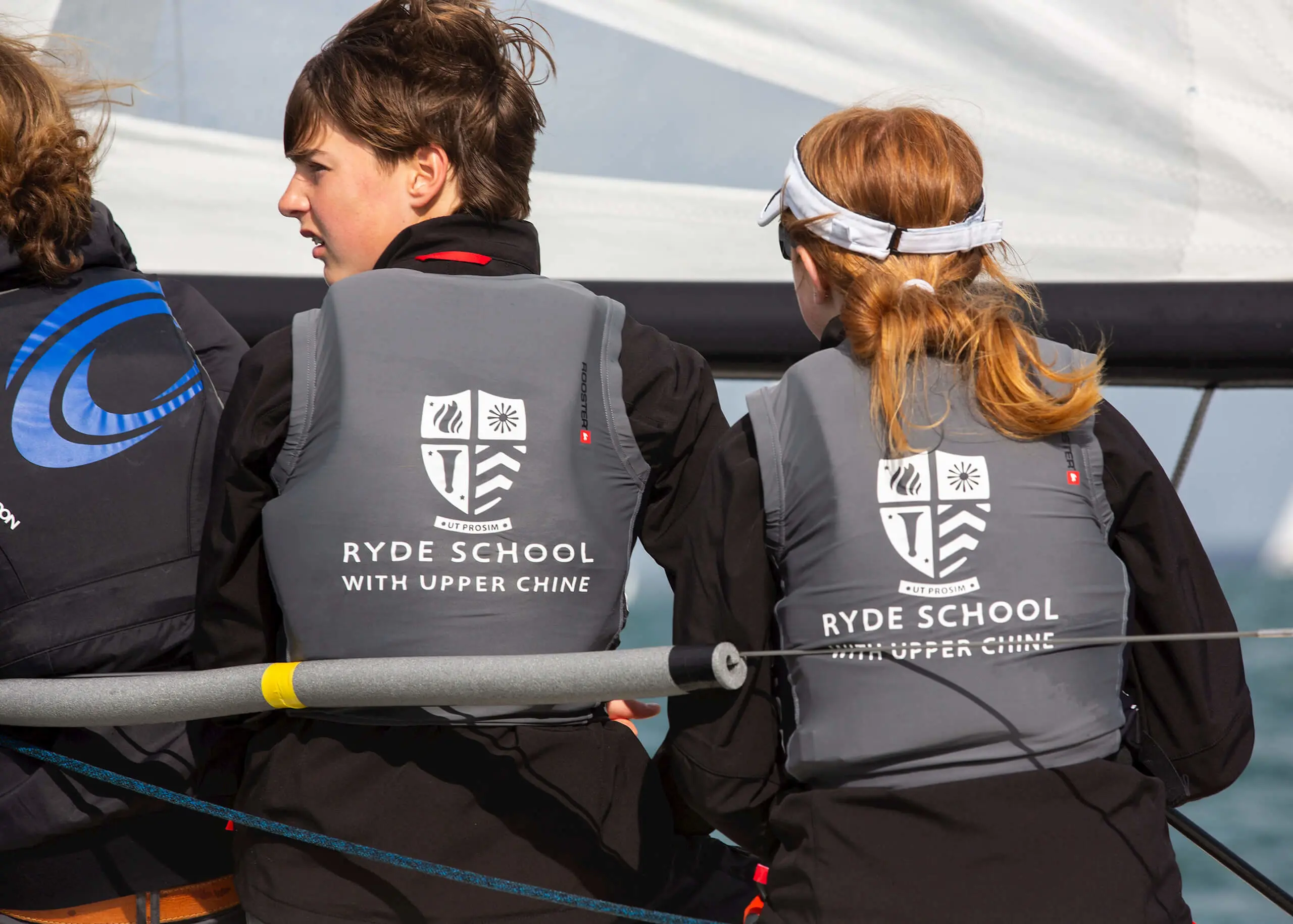 Ryde School Senior pupils sailing, wearing life jackets with Ryde School logo