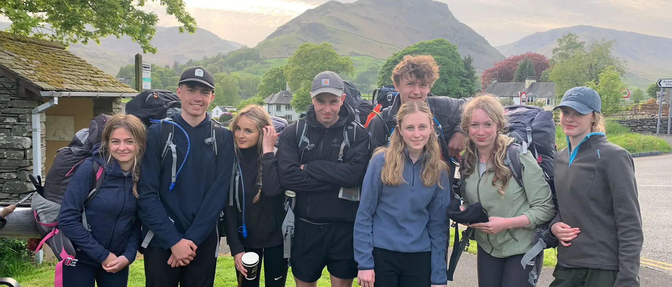group of Ryde School Sixth Form pupils on a D of E expedition with mountains in the distance