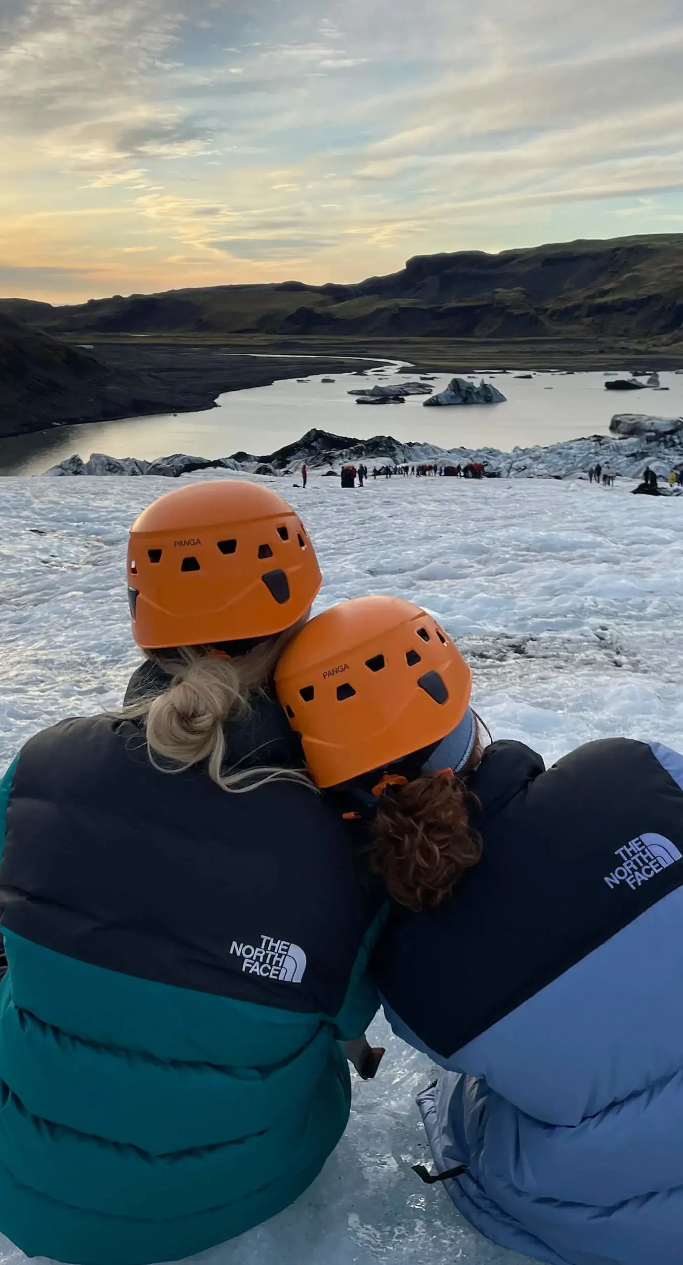 Ryde School Sixth Form pupils on a trip to Iceland sitting on a glacier