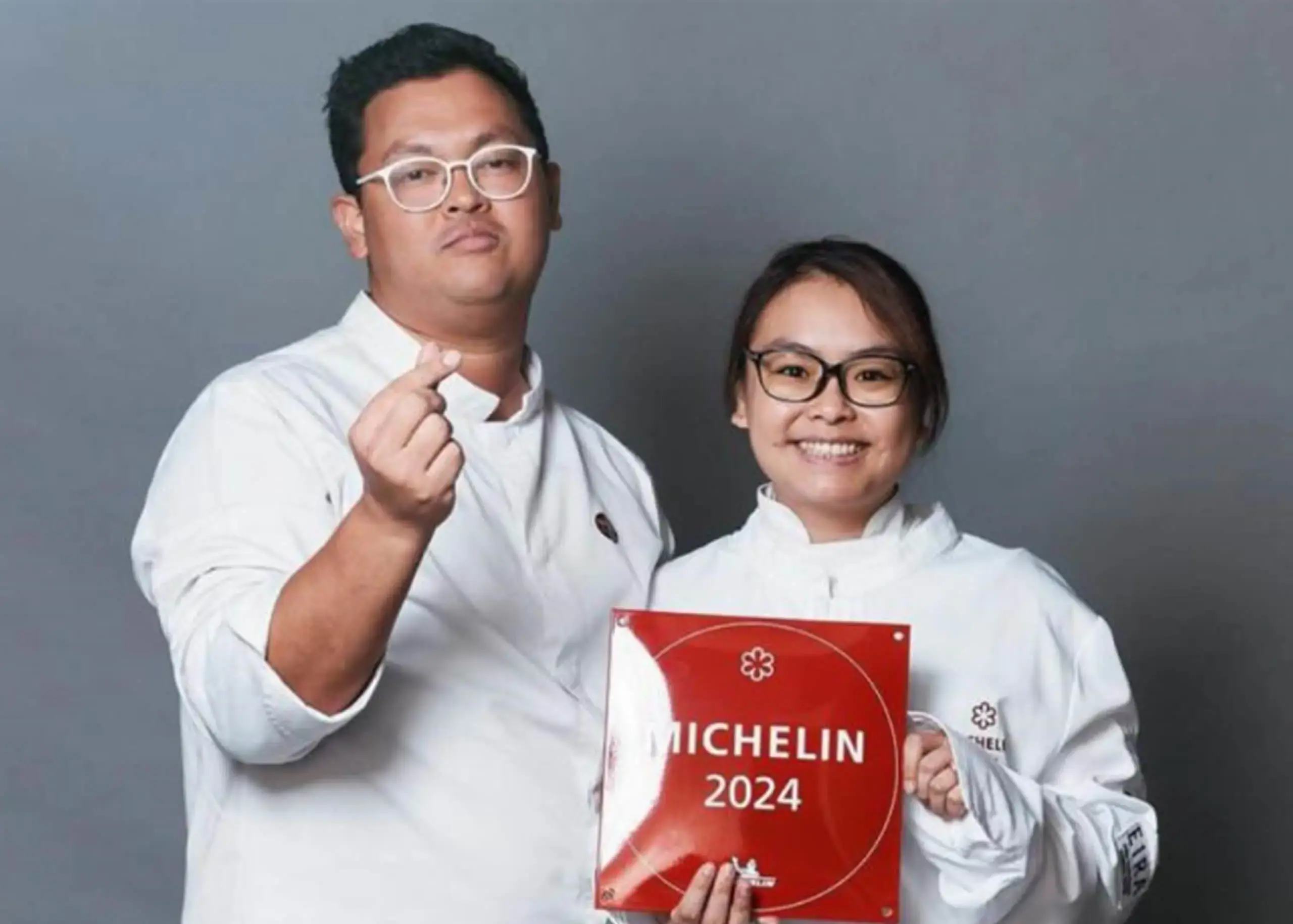Pongcharn ‘Top’ Russell and Michelle Goh with Michelin Star awarded for their restaurant