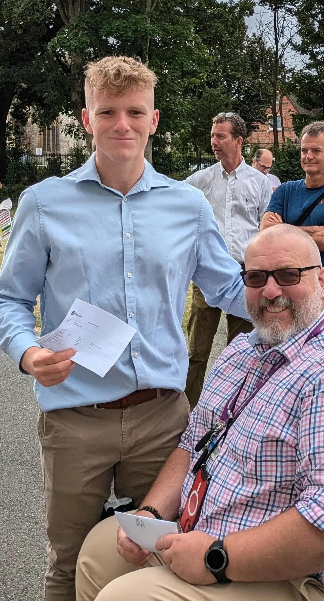 Parent in a wheelchair with sixth form student on results dayPortrait image - Content,Senior Images