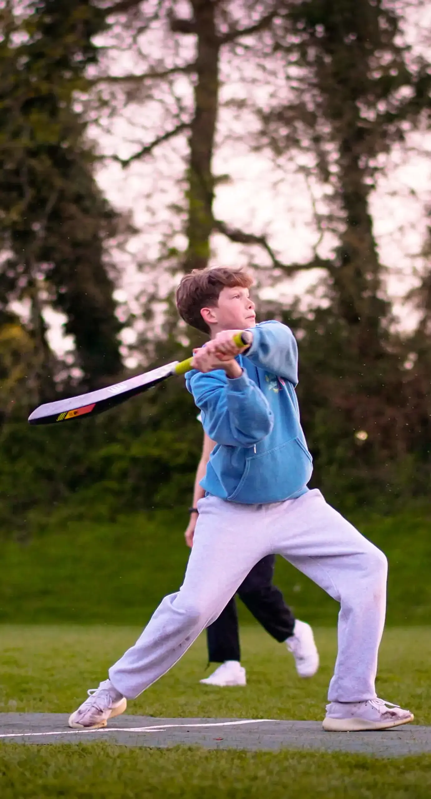 Ryde School pupil playing cricket
