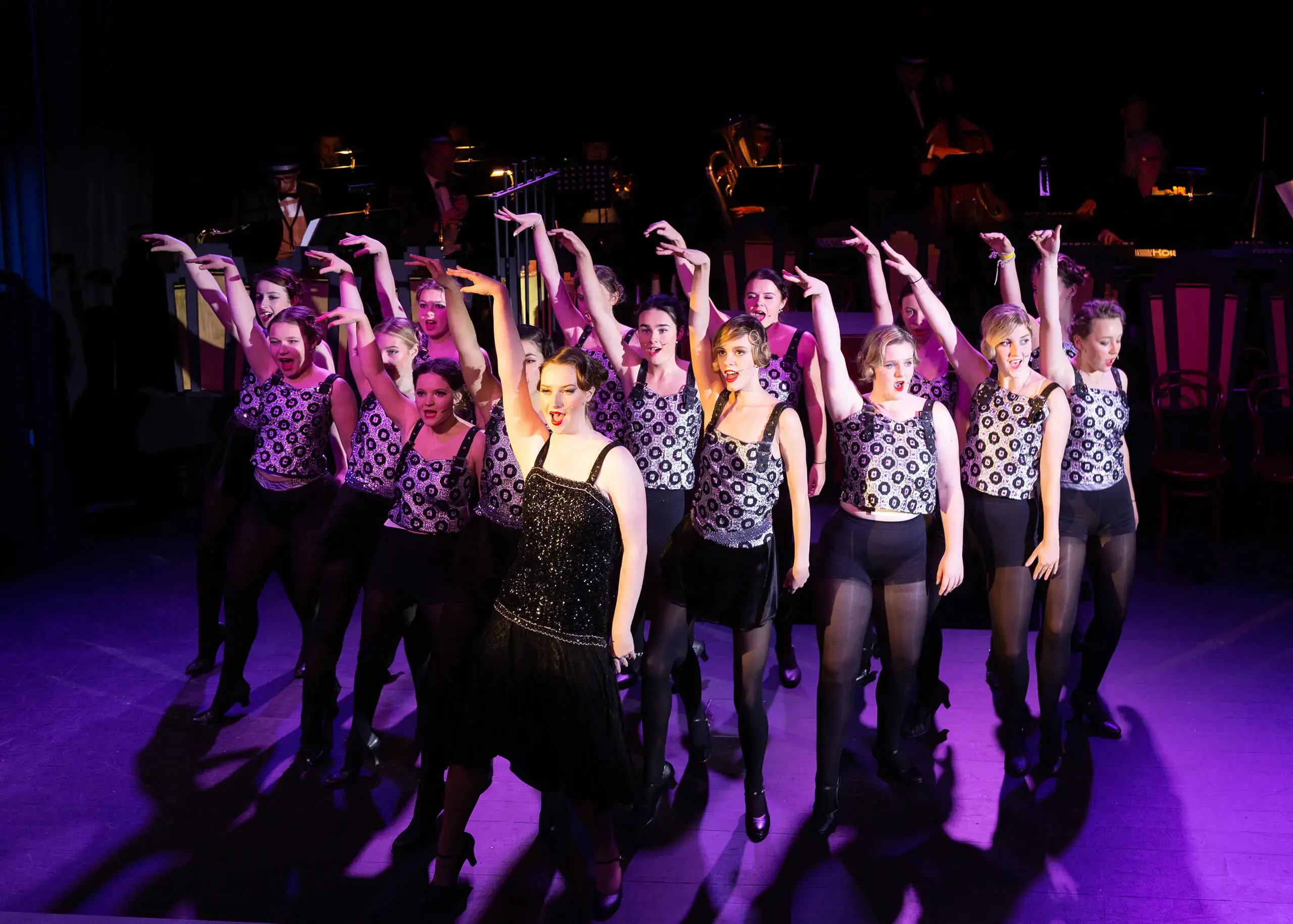 Ryde School sixth form pupils dancing in a theatre production 